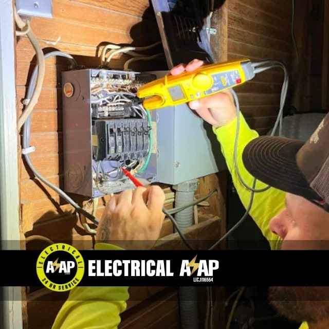 Electrical ASAP electrician testing a residential breaker panel with a digital meter in Bakersfield