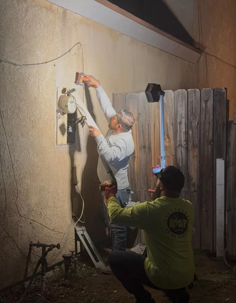 Licensed Electrical ASAP electricians diagnosing an electrical panel during an after-hours emergency call in Bakersfield
